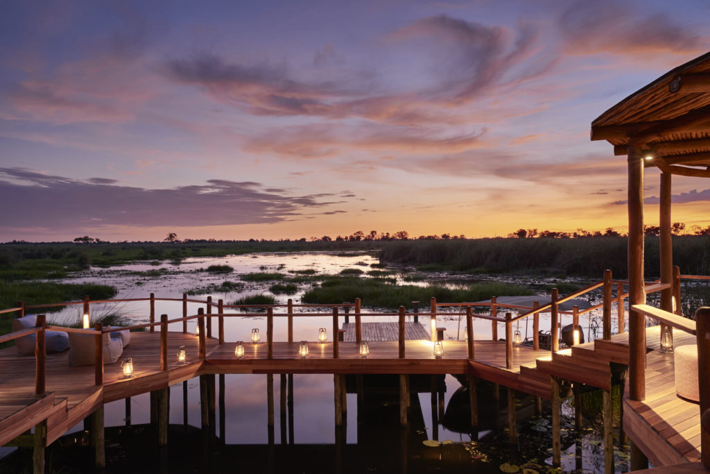 Botswana - Okavango Delta - 1553 - Sanctuary Baines' Camp Decking walkway at dusk